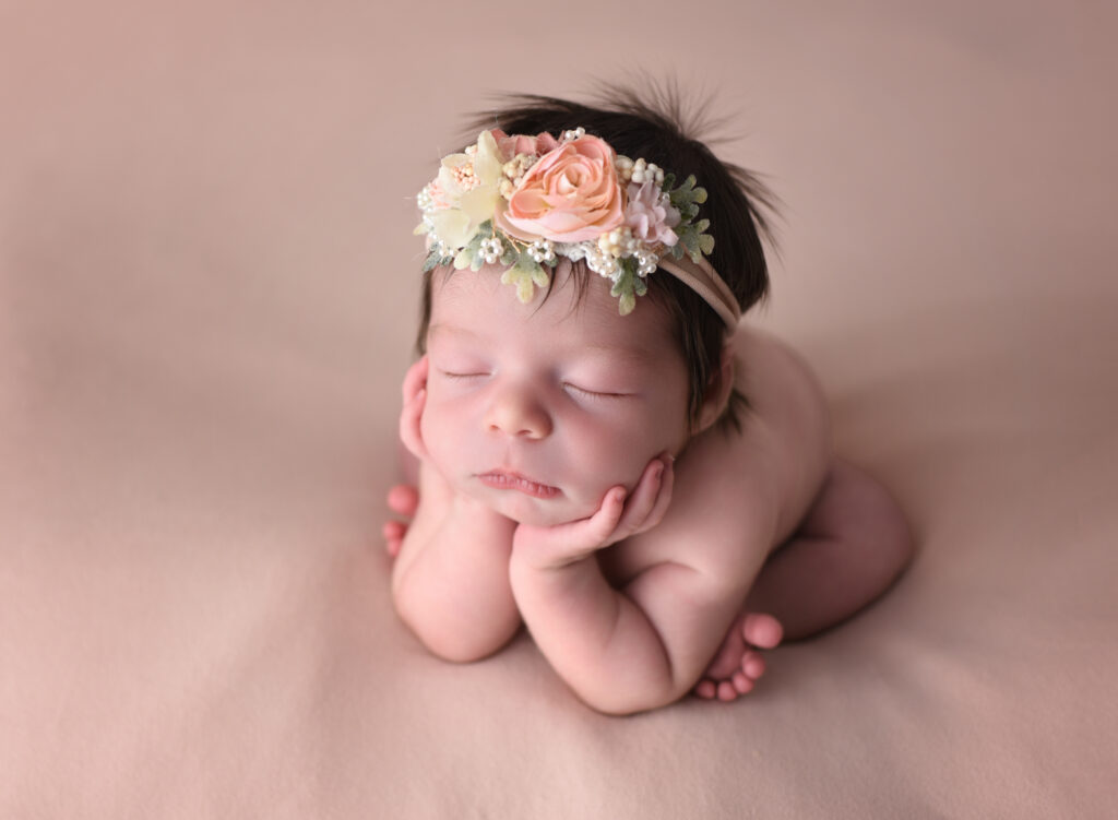 My most asked for pose, Froggy Pose, on my peach backdrop and wrap, posing bag poses, in my cozy studio located in Wallingford, CT 