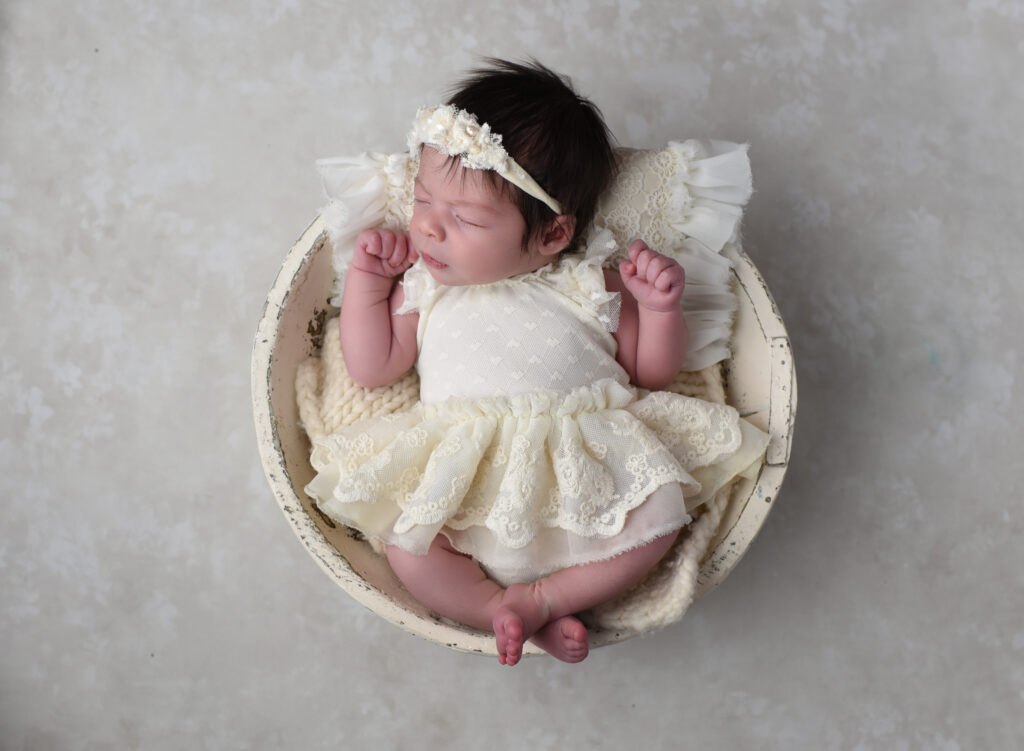 Sweet newborn session, baby in soft ivory dress , taken in my cozy studio located in Wallingford, CT 