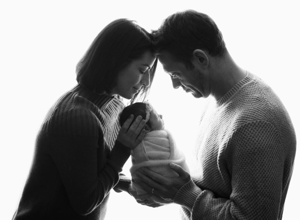 Classic black & white , parents with baby.  