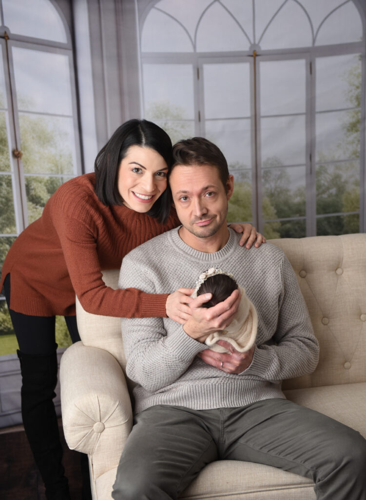 Mom & Dad with their sweet baby girl, all wrapped up nice and snuggly, during my lifestyle portion of this newborn session  