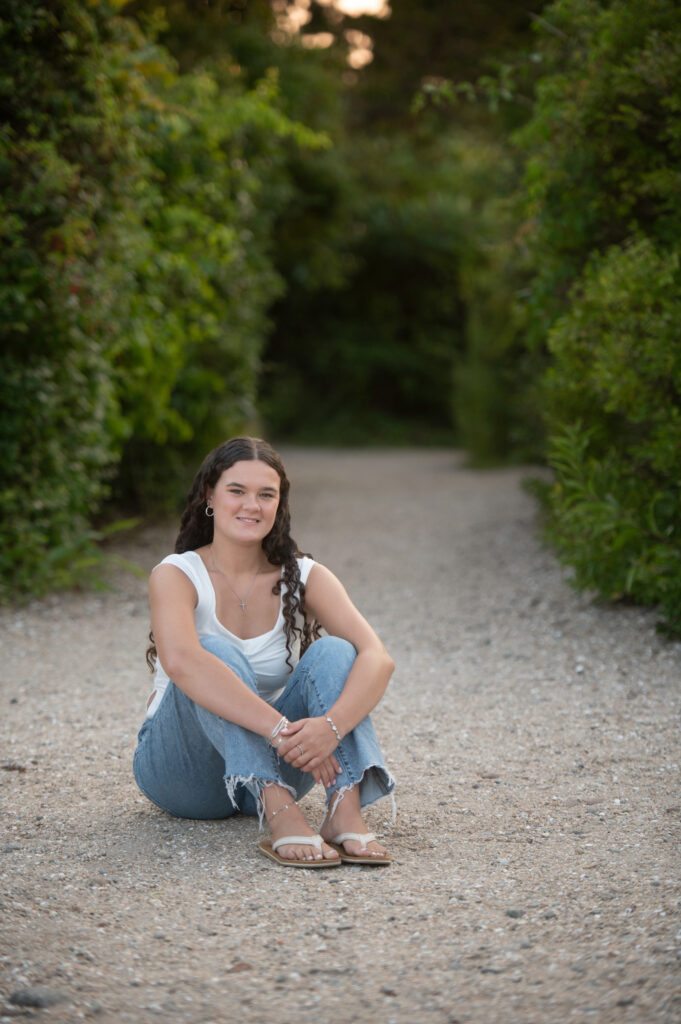 Senior sitting on the path  at Meigs Point, Hammonasset Beach State Park, Madison CT