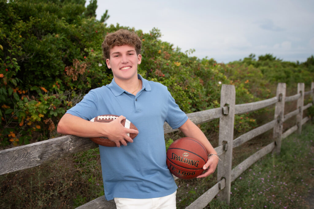 Senior hanging out with his sports gear at Meigs Point, Hammonasset Beach State Park, Madison CT