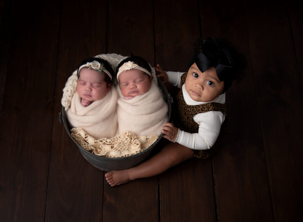 twins and their big sister.  newborn session done at cozy Wallingford studio 