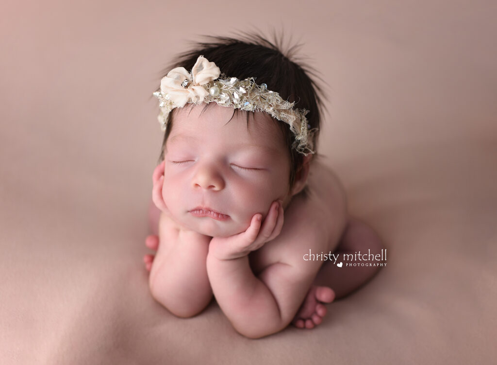 Newborn baby in traditional froggy pose in Wallingford, CT Newborn session done in studio