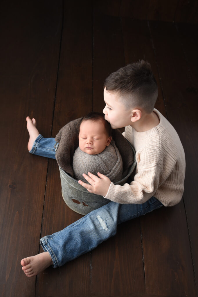 kisses for baby brother during a recent newborn session 